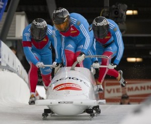 Russia 1, piloted by Alexandr Zubkov (C), jump onboard during Men's World Cup Bobsleigh in Whistler
